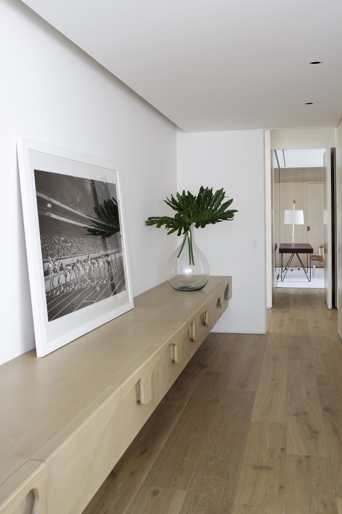 The placement of the entrance at the center of the apartment is unusual but also perfect in this case