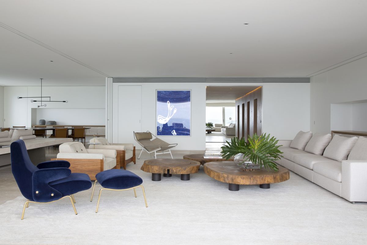 A strategically-placed painting in the living room adds color to the space and creates symmetry