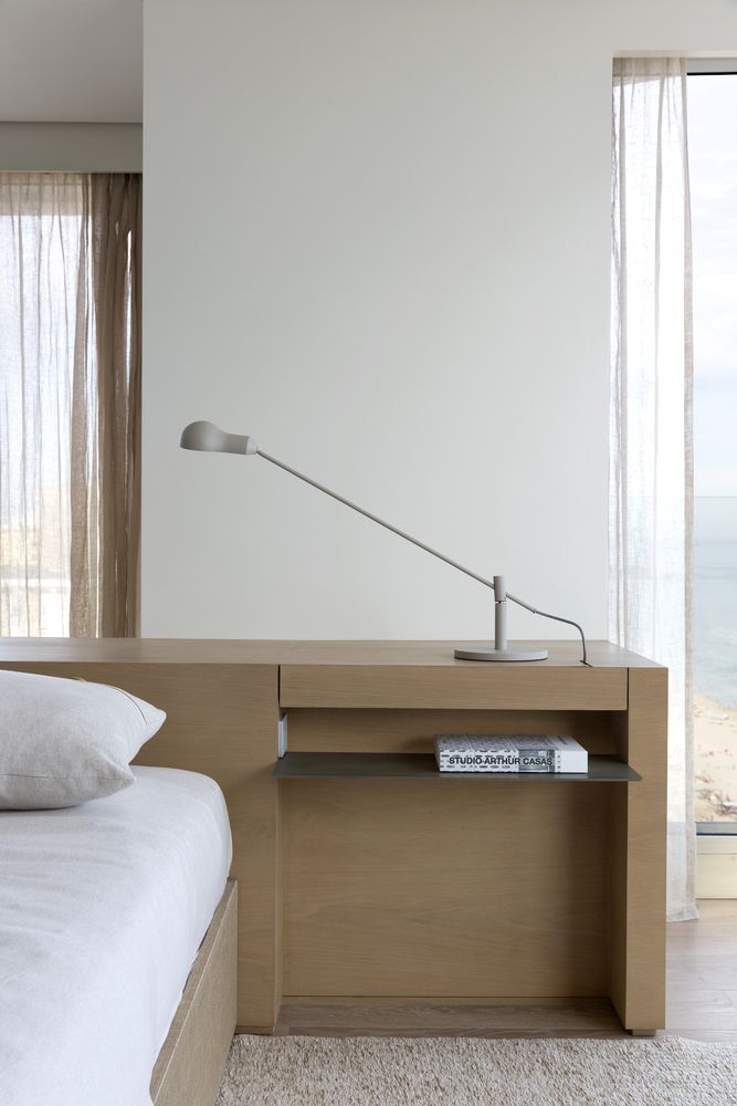 The bedrooms are minimalist and decorated in neutral and warm color tones