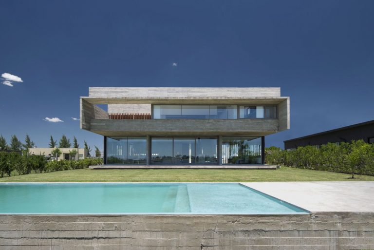 A Modern Concrete House Opens Towards A Beautiful Lagoon