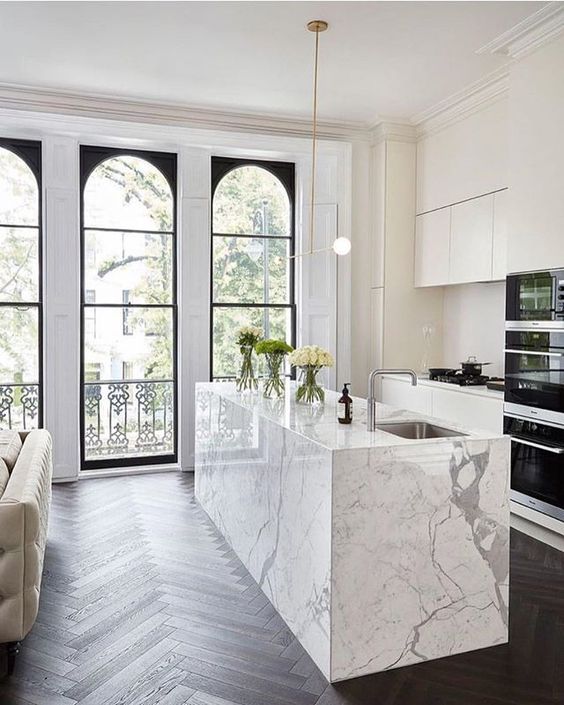modern all white kitchen with marble island