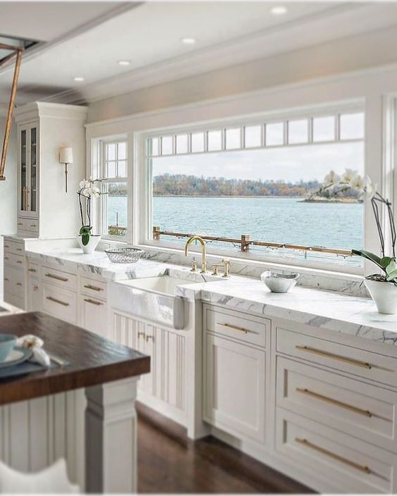 all white kitchen cabinets with modern gold handles