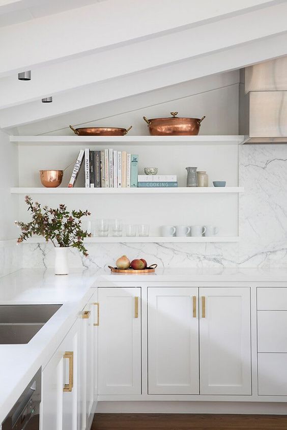 all white attic kitchen with marble backsplash and open shelves