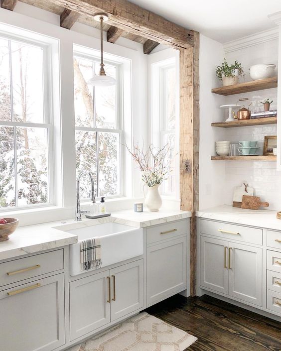 all white kitchen with reclaimed wood open shelves