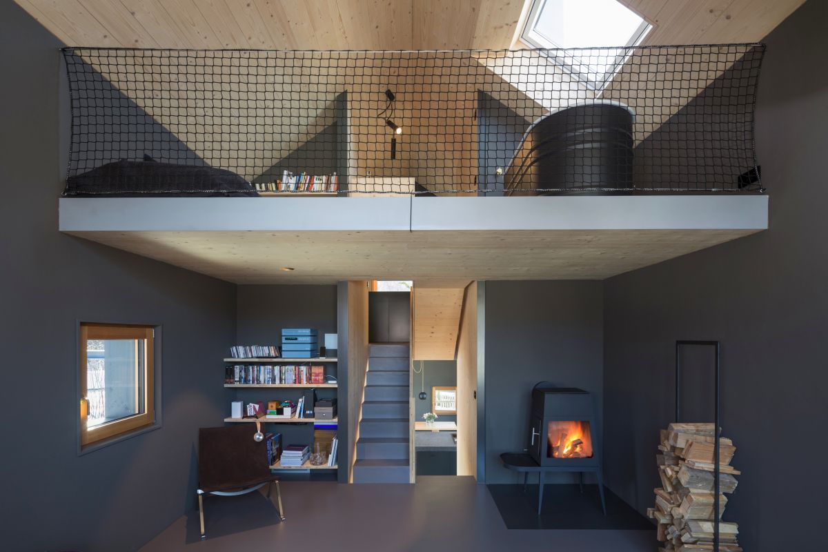 A wood-burning stove adds a warm and cozy touch to the living area