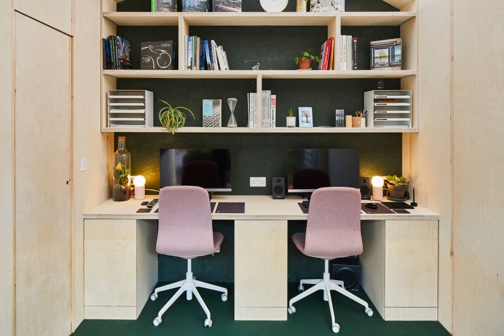 One section of the interior is occupied by a double workstation