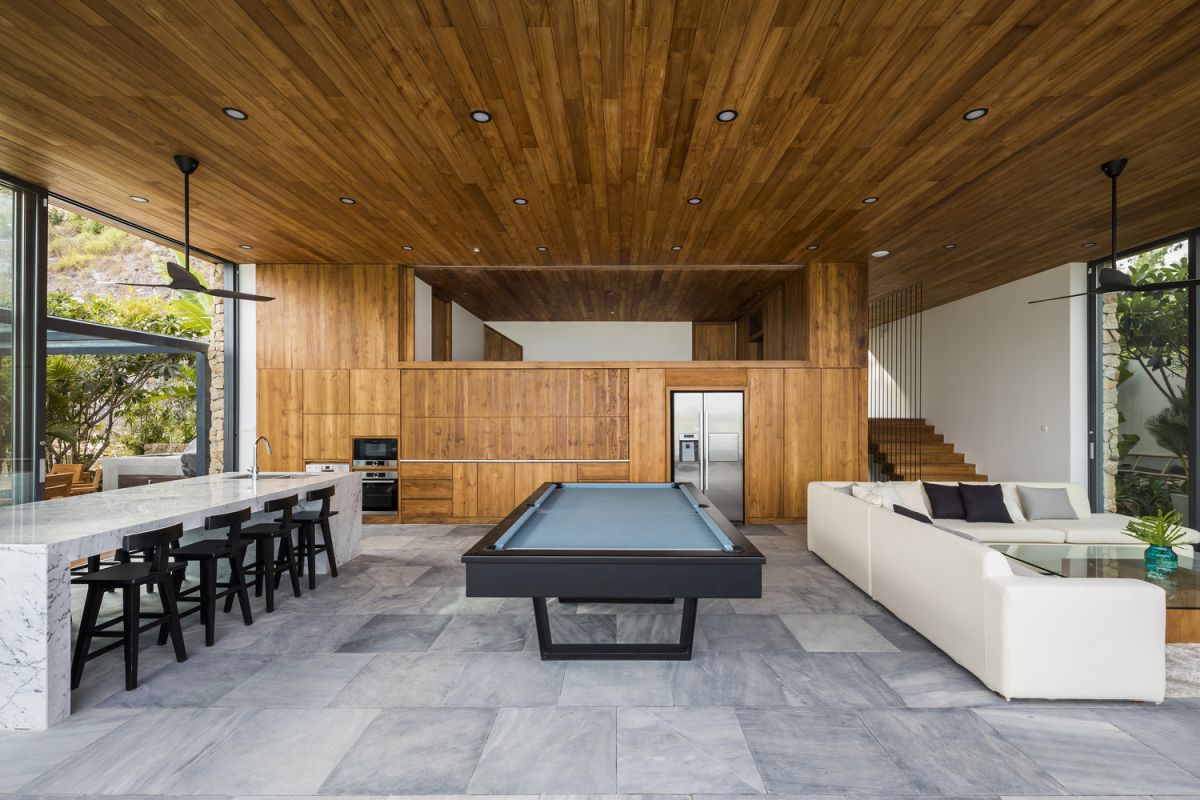 It's not just the exterior of the house that's infused with wood but also the interior where the timber adds a warm touch to the decor