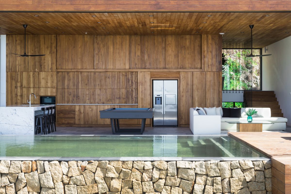 The living room, kitchen and dining area are blended into one like in most contemporary homes