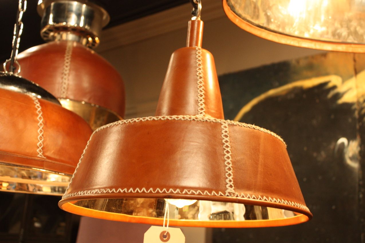 Leather-covered pendants from Bobo Intriguing Objects are warm but rustic.