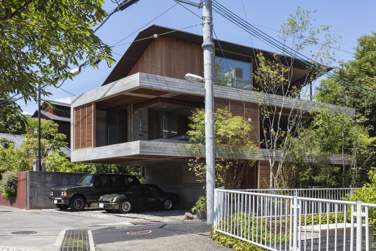 The concrete surfaces are complemented by lots of warm wood throughout the exterior