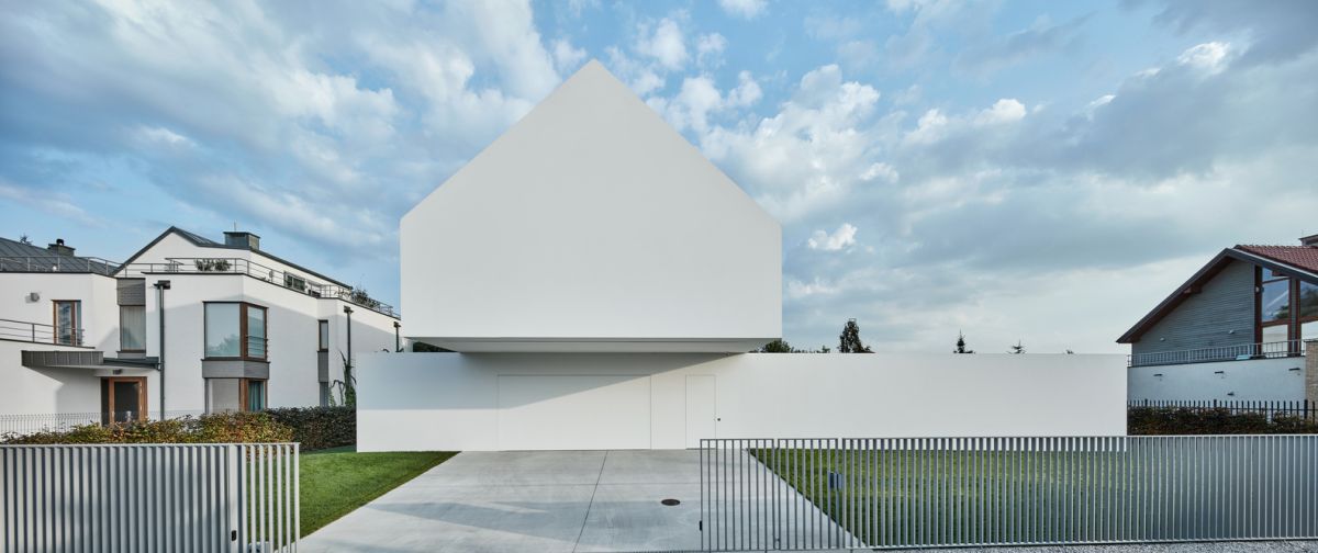 Compared to the neighboring houses, this one is visibly different even though it respects the local building guidelines