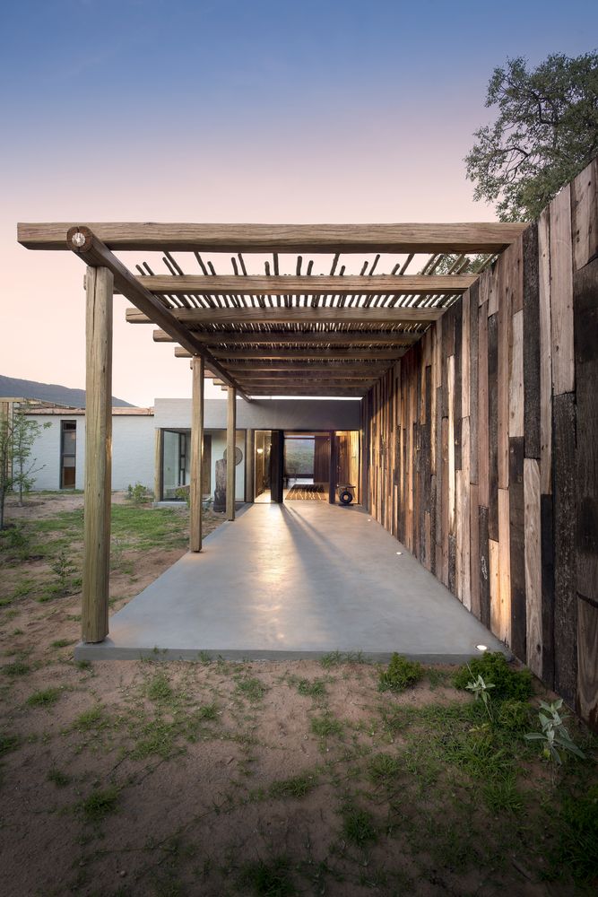 Covered walkways and verandas stretch all around the house in various directions