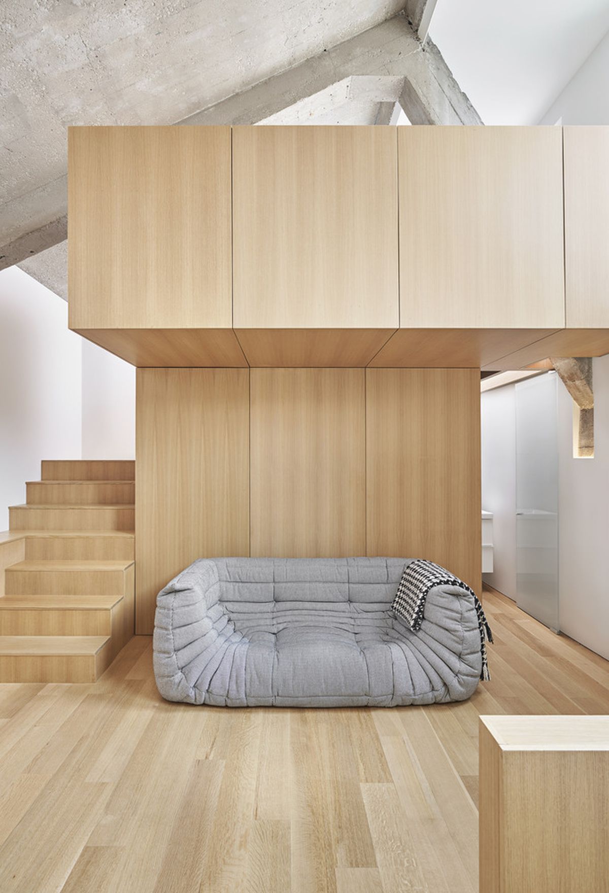 The concrete ceiling is one of the most industrial features of this loft and has been preserved as such