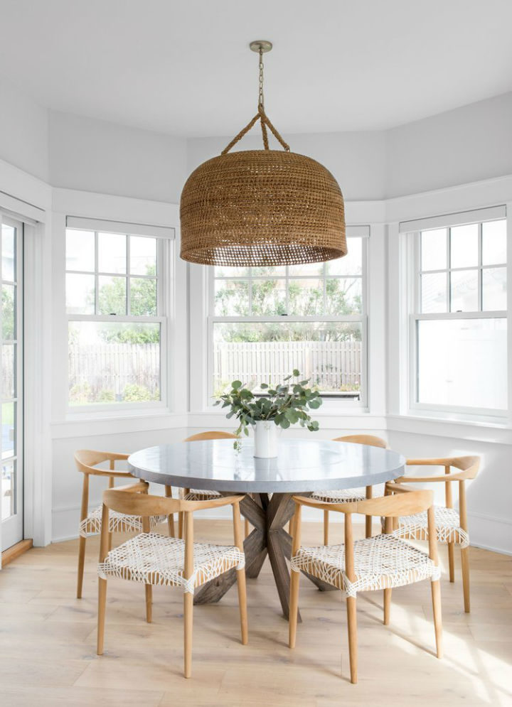 timeless and airy dining room with round table