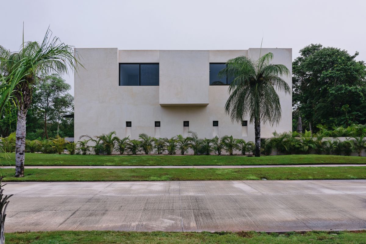 The facades are mainly closed off, with the windows and a minimalistic aesthetic