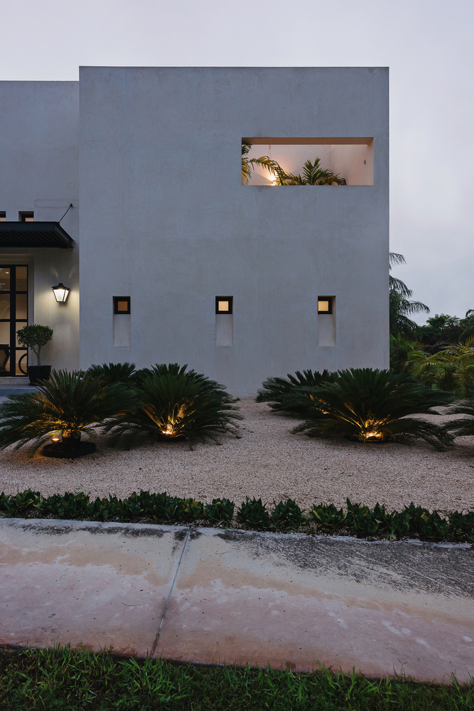 Ambient lights have been seamlessly embedded into the landscape, adding curb appeal