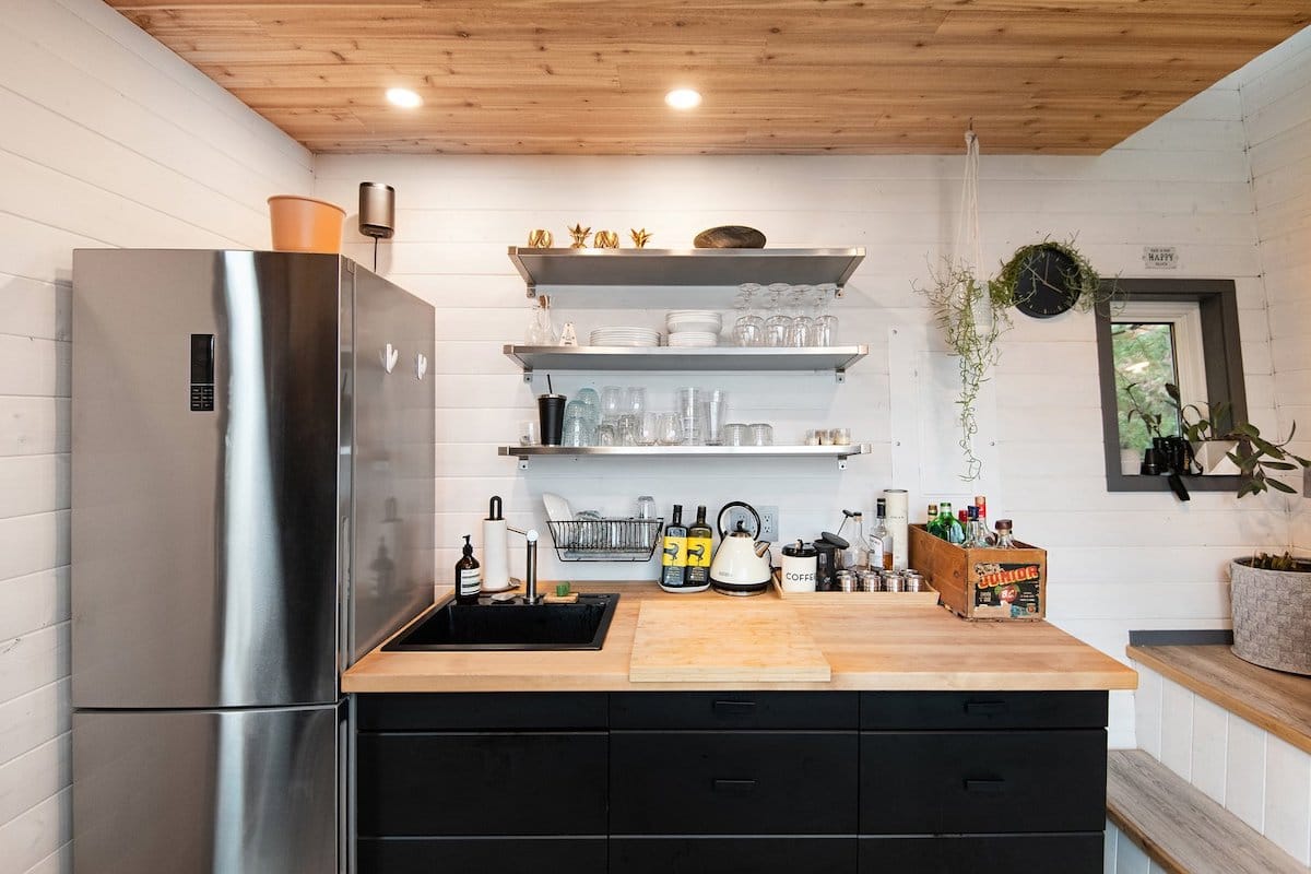 The kitchen is small but has room for a fridge and some counter space