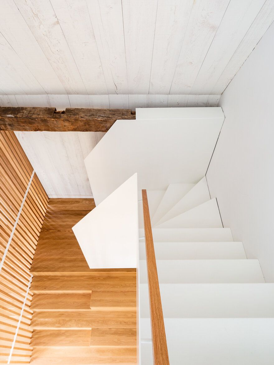 The two staircase feature very different styles but actually complement one another nicely