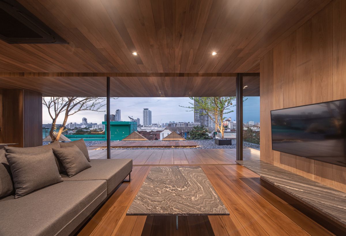 Full-height windows and glass doors provide panoramic views and give the illusion of a larger space