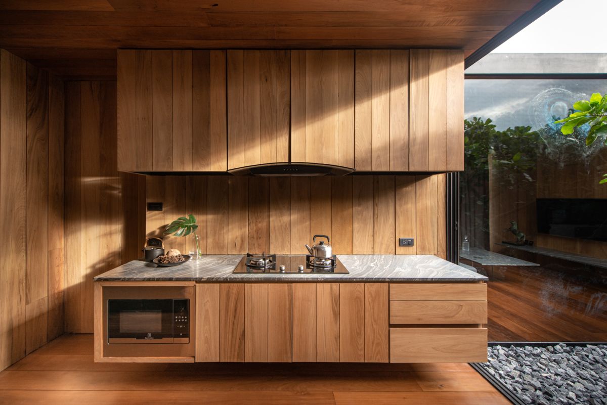 This quirky rooftop house has a living room, a dining area, a kitchen, a bedroom and a bathroom