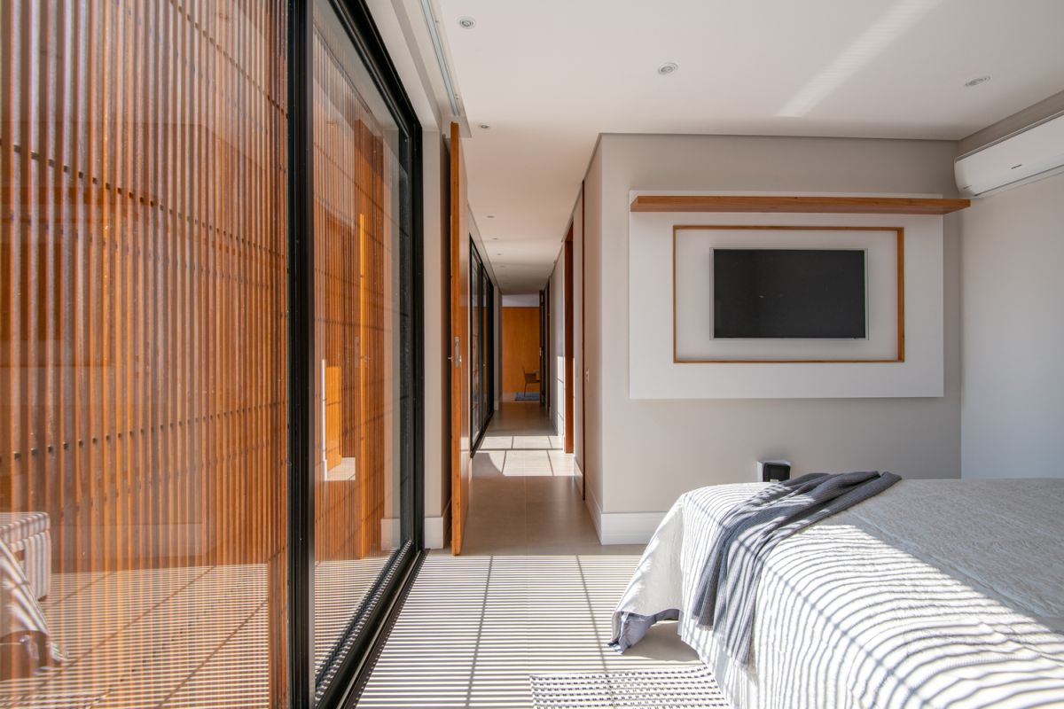 Wooden surfaces are scattered all over the house, adding warmth and color to the rooms