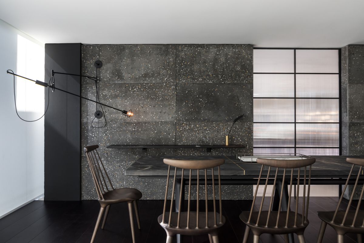 This accent wall built using concrete boards is a source of masculinity for the entire decor
