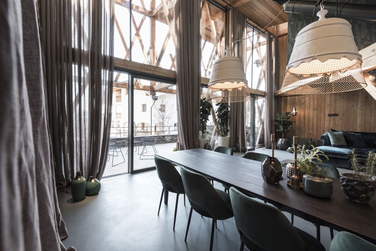 Sliding glass doors ensure a seamless transition between the living spaces and the exterior