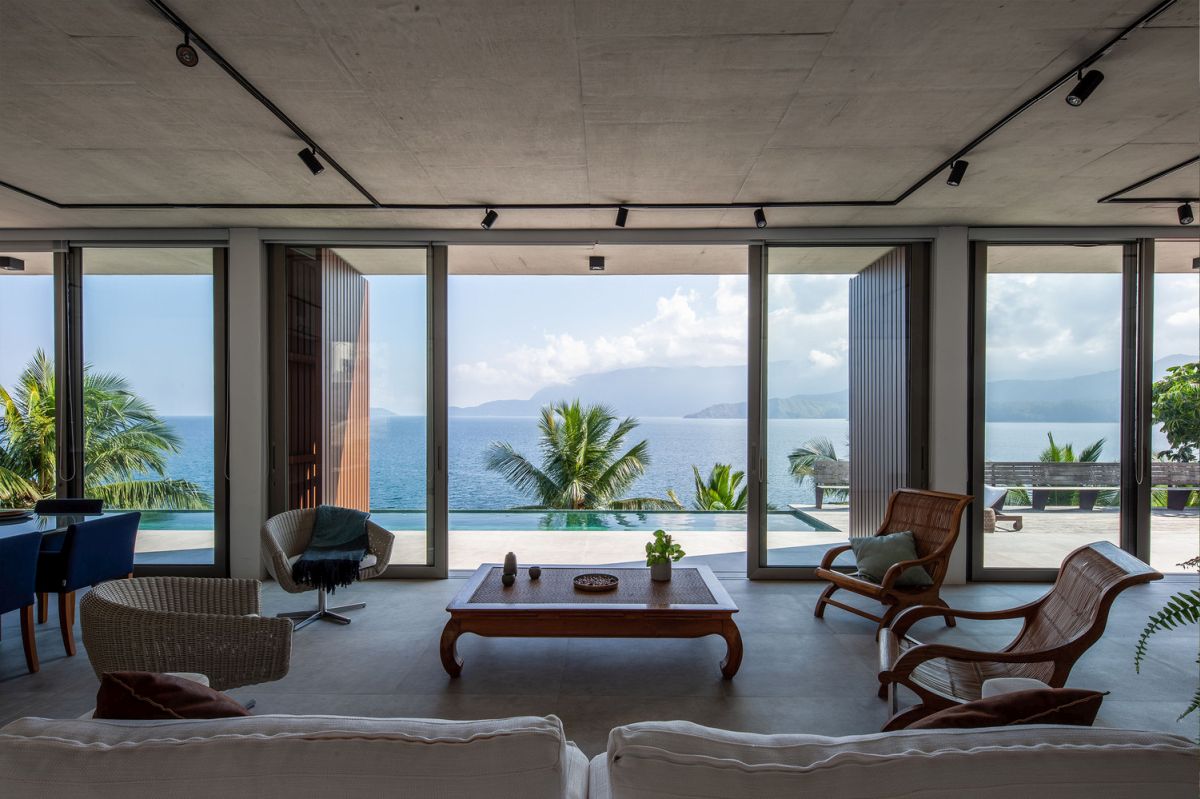 The living area features a large sitting area oriented towards the spectacular view 