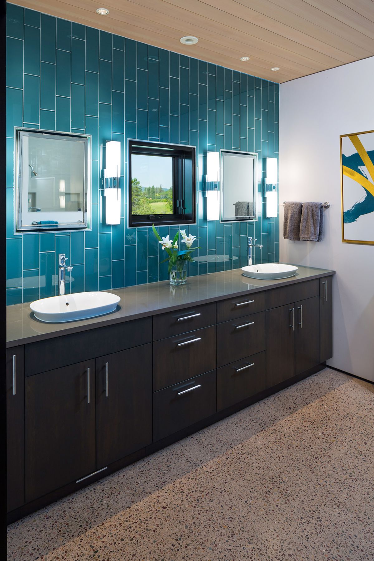The main bathroom has the same turquoise accents as the kitchen