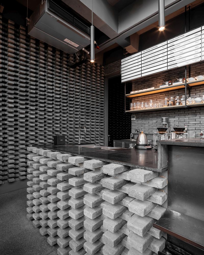 The interior design as a whole is eclectic, featuring industrial elements combined with a contemporary decor
