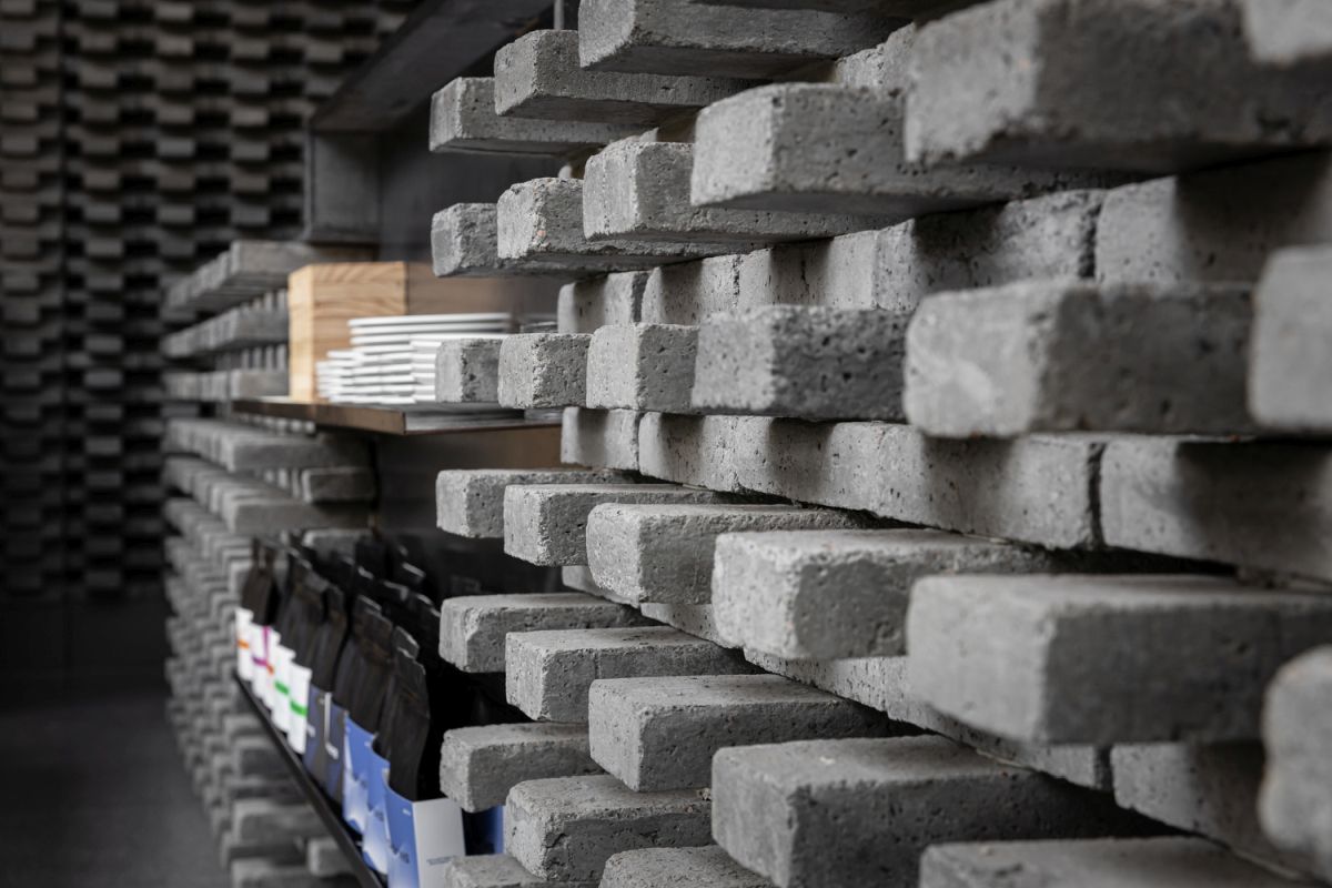 The concrete brick add ruggedness and industrial charm to the interior design