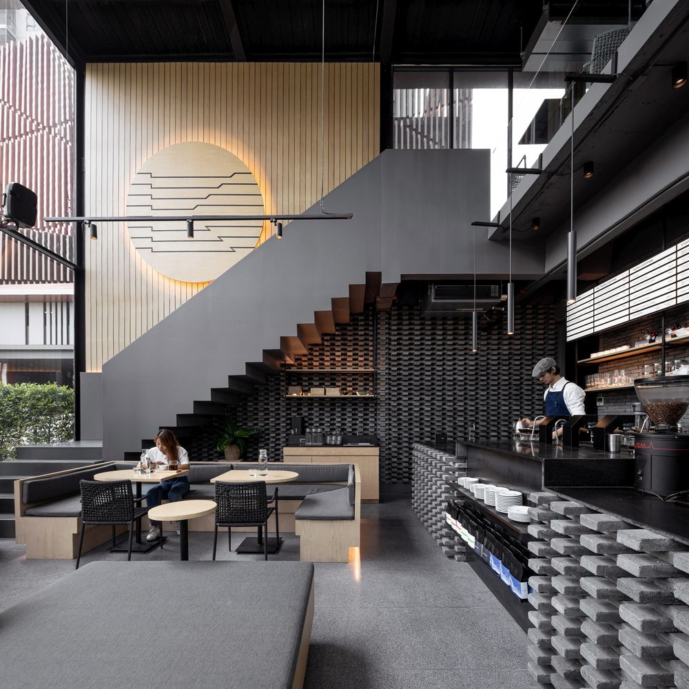 One of the most eye-catching features is the large wooden disc displayed on the staircase wall