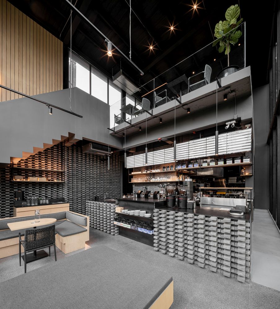 The upstairs seating area overlooks the bar below and has a clear view towards the street