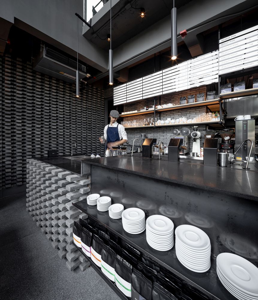 The neutral palette of colors shifts the focus towards the materials and finishes used throughout the shop