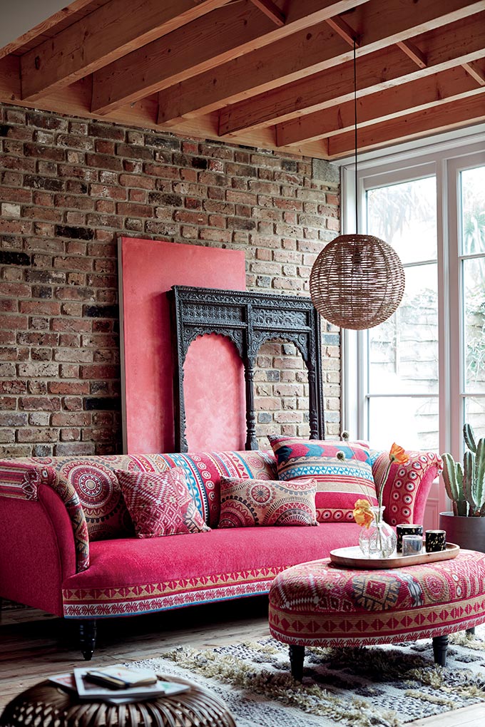 boho living room with pink sofa