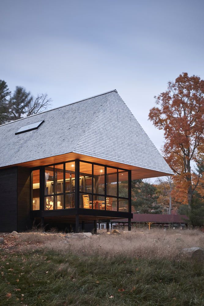 The design of the roof is distinctive, referencing the big historic cottages from this region