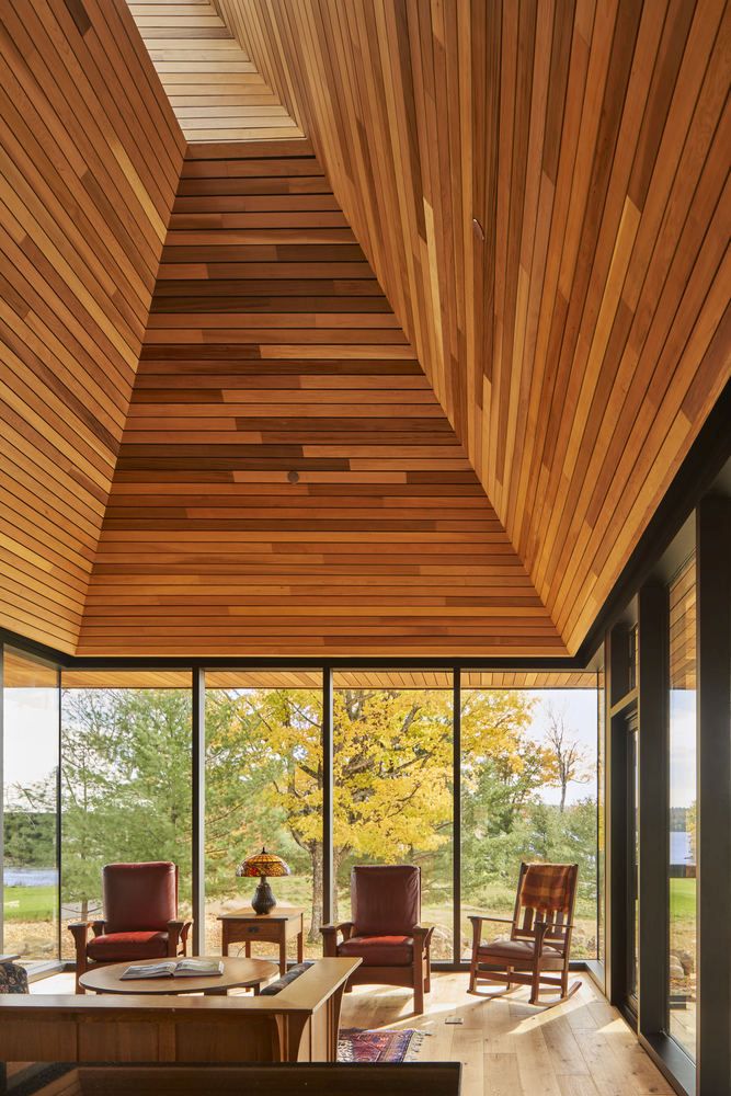 The shiplap wooden walls also reference the interior of a canoe