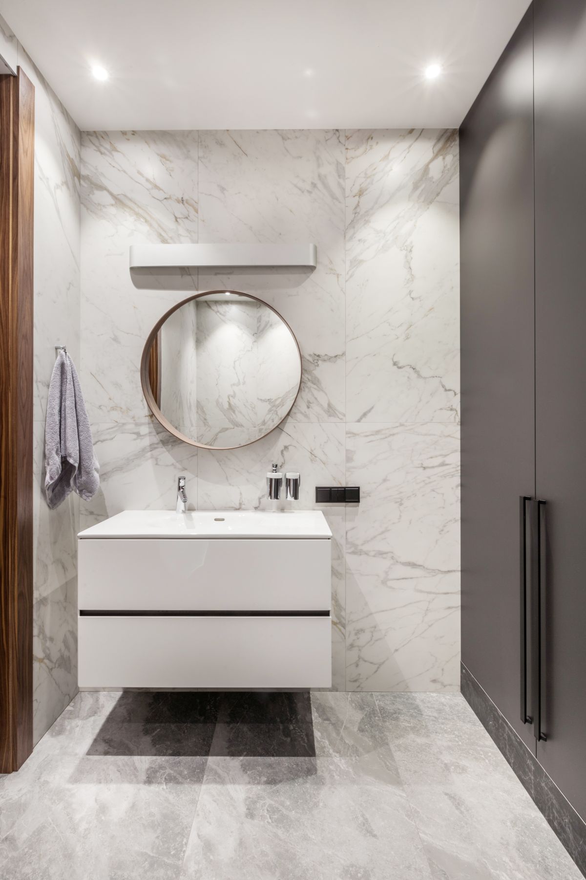Marble really is timeless and this stylish powder room proves with its chic design and simplicity 