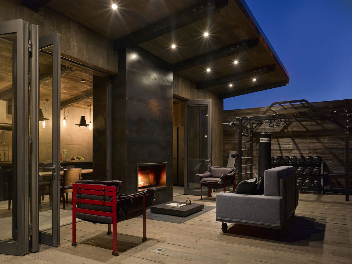 Outside, the kitchen extends into a terrace situated between it and the main house