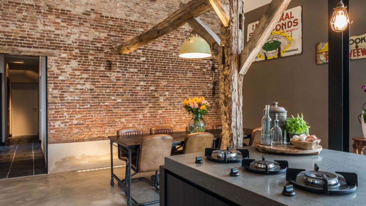 The brick wall was left exposed and empty, becoming a focal point for the entire house