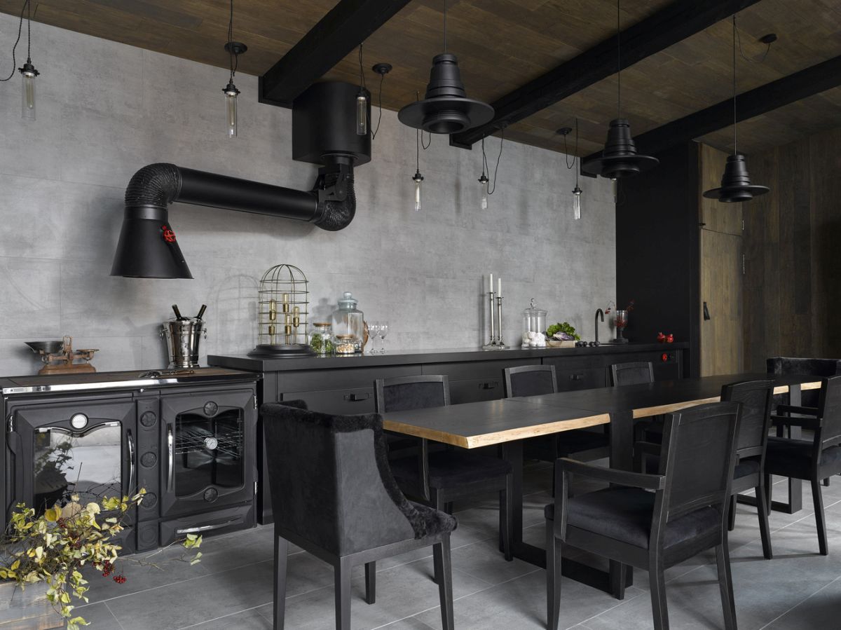 This summer kitchen has a strong industrial appearance due to array of materials used inside and out