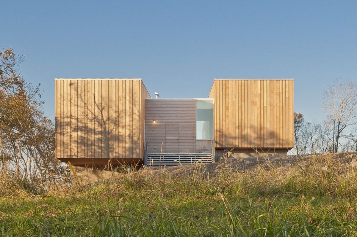 The pavilions are connected by a common and much smaller space which houses the entryway