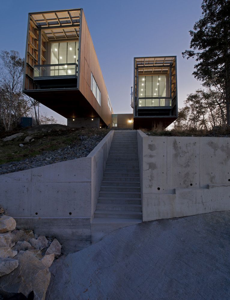 As the two pavilions extend over the landscape, a pathway opens up between them