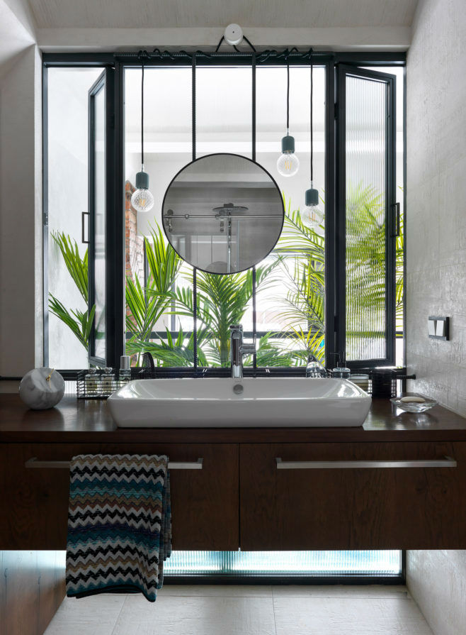 bathroom with large window above the bathroom sink