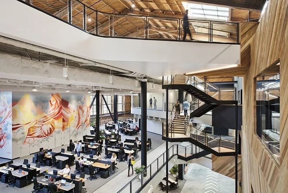 The new Google office is composed of open workspaces and elevated walkways which emphasize the idea of collaboration