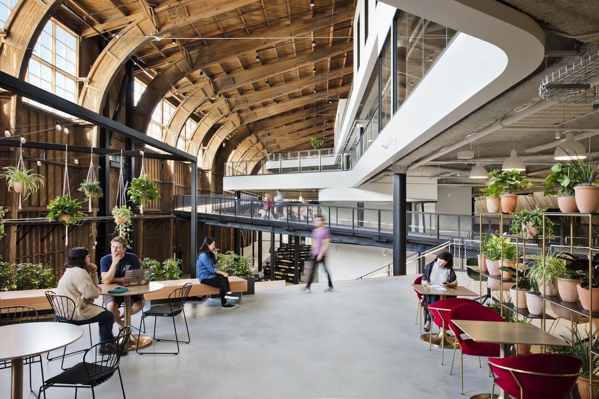 The office is a building within a building, using the historic wooden hangar as a shell