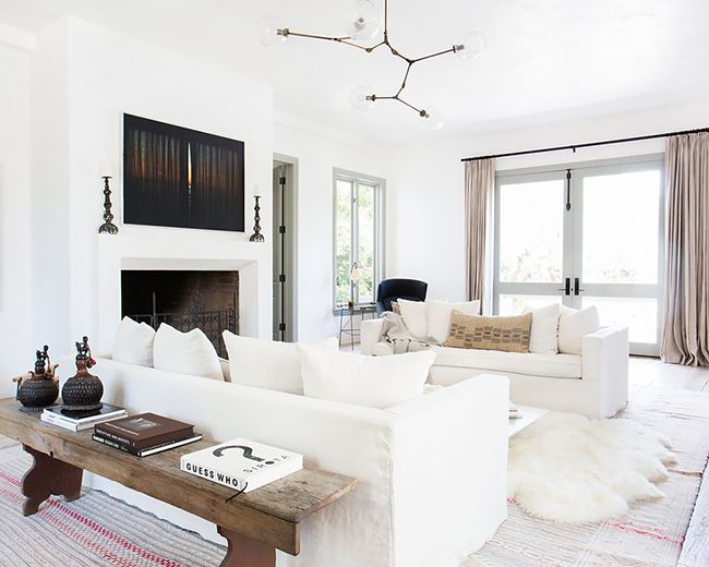 This is a living room designed by Vanessa Alexander and features a modern decor with Tuscan influences