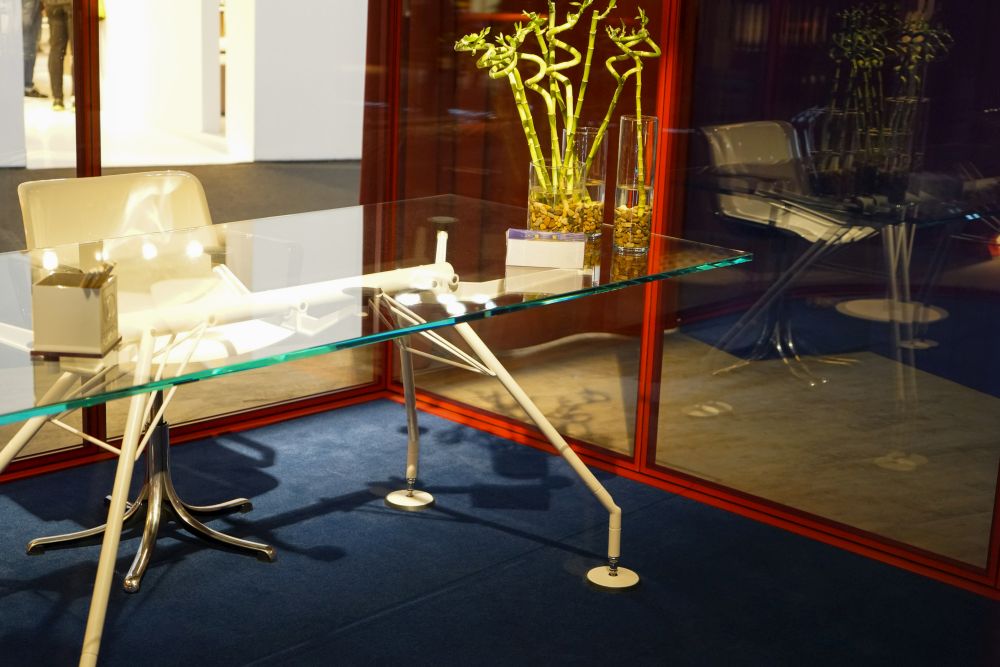 A glass desk is a chic office furniture idea.