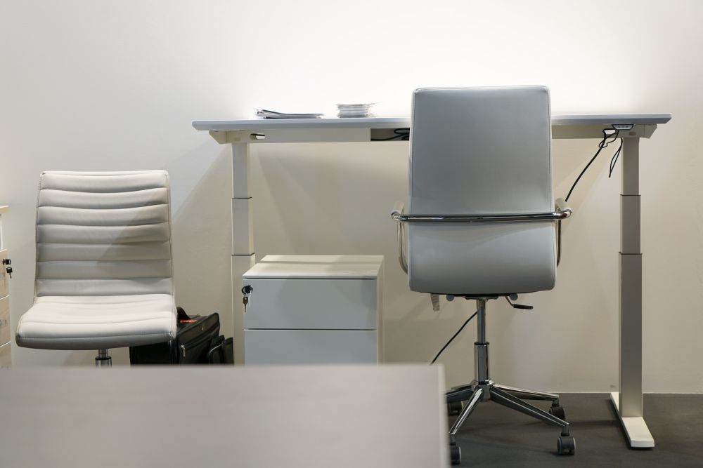 Adjustable desks allow for sitting or standing.