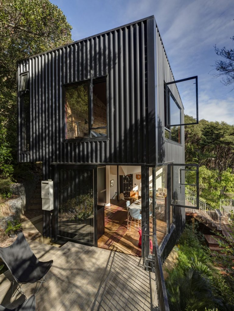 A Black House With A Tower-Like Design In The Canopies of New Zealand